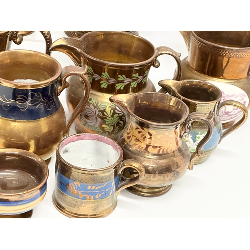 298 - A collection of Victorian lustre jugs.