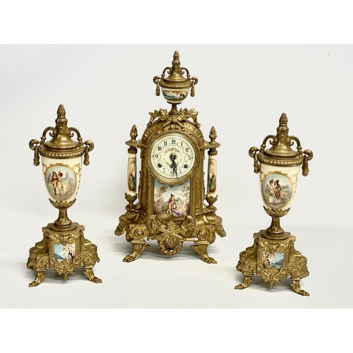 43 - An 18th century style Franz Hermle brass clock set. Clock measures 22x41cm.