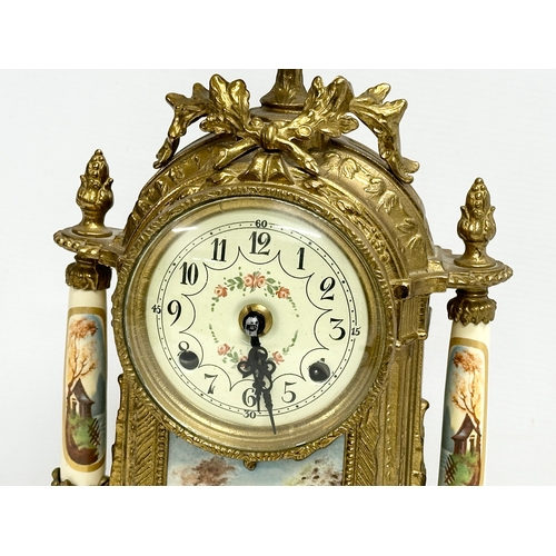 43 - An 18th century style Franz Hermle brass clock set. Clock measures 22x41cm.