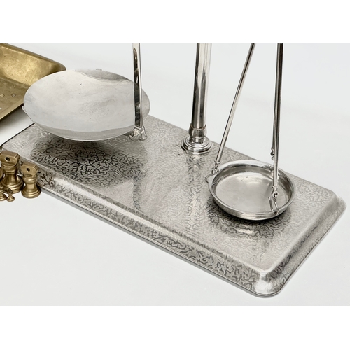 313 - A Co-Operative Wholesale Society balance scales with brass weights. 51x26x54cm