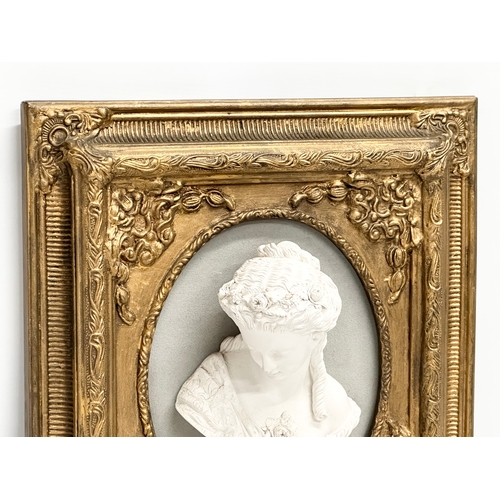 318 - A gilt framed wall plaque. 35.5x11x40.5cm