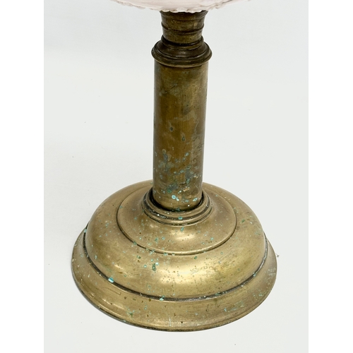 321 - A Victorian embossed milk glass oil lamp with brass column. 35cm