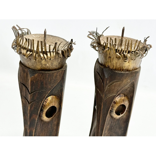 325 - A pair of 20th Century African style wood and brass candleholders. 30cm