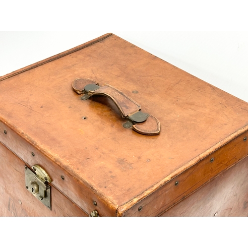 331 - A Late 19th/Early 20th Century leather bound steamers trunk. 51x43x40cm