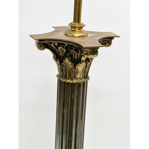 200 - A large vintage brass table lamp with Corinthian style column. Base measures 17x17x74cm.