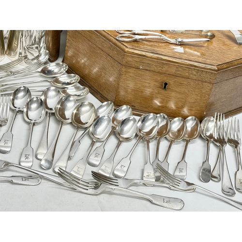 366 - A collection of silver plate. A Walker & Hall oak cutlery box. Walker & Hall silver plated cutlery w... 