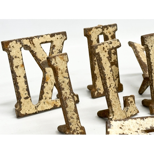 367 - A collection of vintage cast iron Roman Numerals