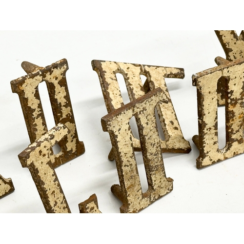 367 - A collection of vintage cast iron Roman Numerals