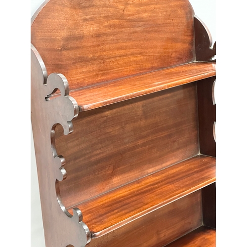 343 - A 19th Century Victorian mahogany wall mounted shelving unit. 56x17x96.5cm