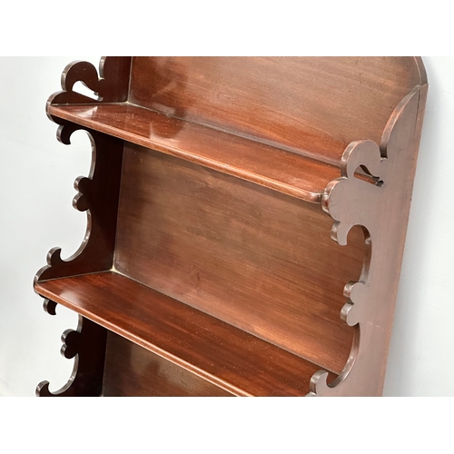 343 - A 19th Century Victorian mahogany wall mounted shelving unit. 56x17x96.5cm