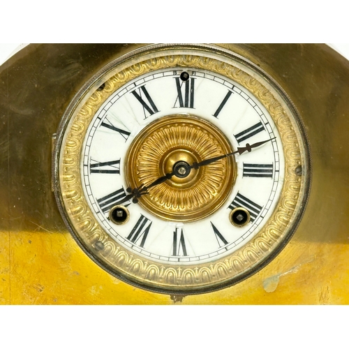 344 - A Late 19th Century brass mantle clock by Ansonia Clock Co. With pendulum. 44x15x27cm