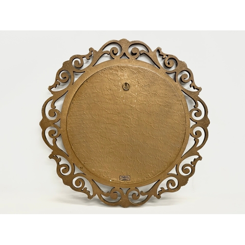 355 - A vintage Aisonia gilt framed convex mirror. 58cm