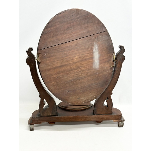 368 - A Victorian mahogany dressing mirror.