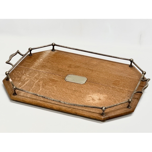 369 - An Early 20th Century oak and silver plated serving tray. Circa 1910-1920. 55x50x7cm