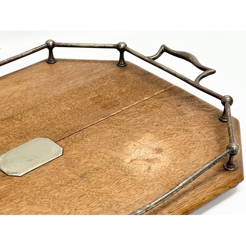 369 - An Early 20th Century oak and silver plated serving tray. Circa 1910-1920. 55x50x7cm