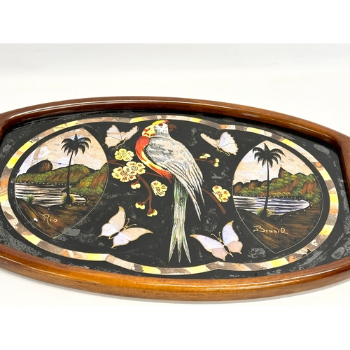 398 - A Mid 20th Century Brazilian serving tray with Mother of Pearl parrot and butterfly design. 70x41cm