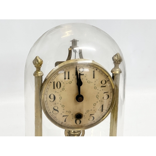 399D - An Early/Mid 20th Century brass anniversary clock with key. 18x26cm