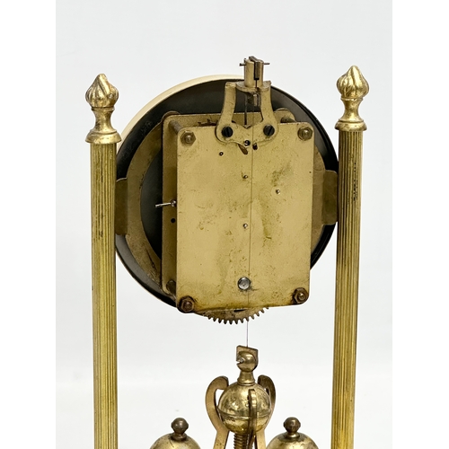 399D - An Early/Mid 20th Century brass anniversary clock with key. 18x26cm