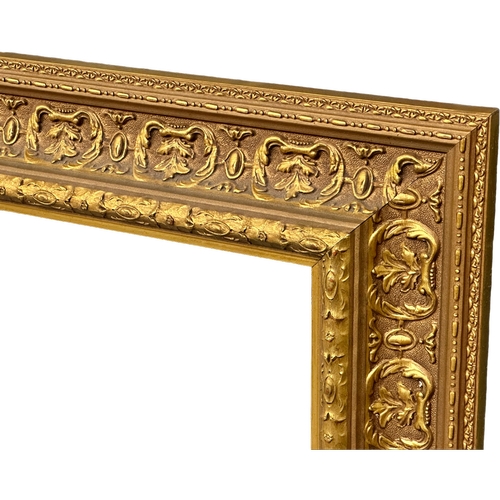 398A - A large good quality Victorian style gilt framed bevelled mirror. 122x96cm