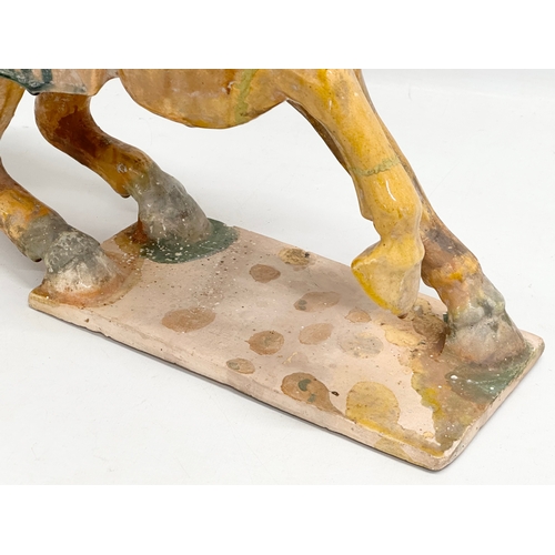 60A - A 19th Century Chinese Tang glazed terracotta horse. 36x36cm