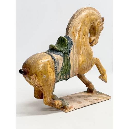 60A - A 19th Century Chinese Tang glazed terracotta horse. 36x36cm