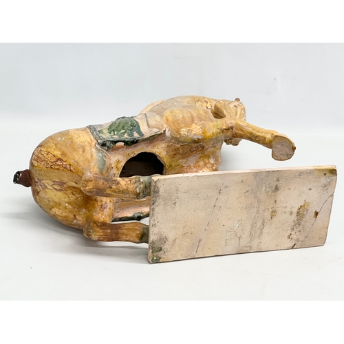 60A - A 19th Century Chinese Tang glazed terracotta horse. 36x36cm