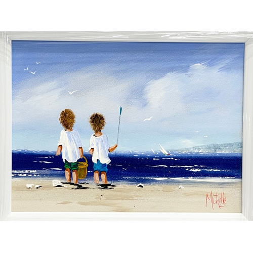 175 - An oil painting on board by Michelle Carlin. Children at the Beach. 39.5x29cm. Frame 56x46cm