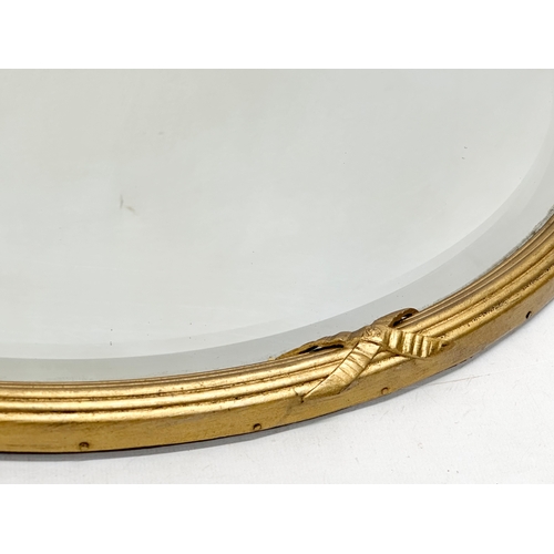 391 - A Late Victorian gilt framed bevelled mirror. Circa 1900. 51cm