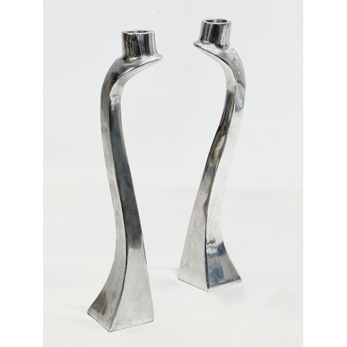 60E - A pair of polished aluminium candlesticks designed by Mathew Hilton. 30cm