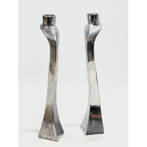 60E - A pair of polished aluminium candlesticks designed by Mathew Hilton. 30cm