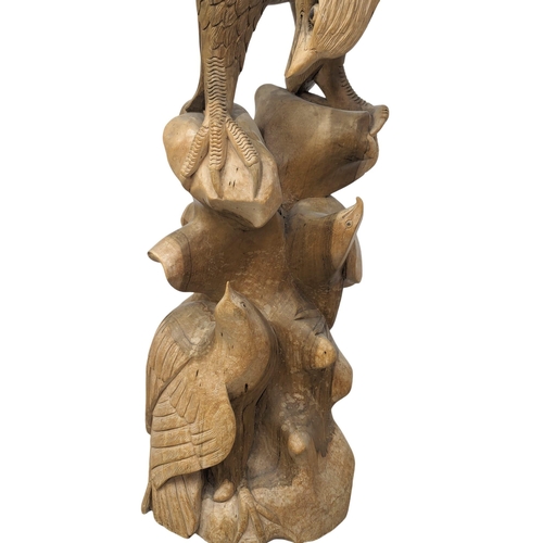 341 - A large carved wooden eagle. 119cm