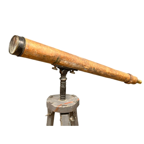 80 - A 19th/Early 20th Century leather bound telescope on tripod. 150cm