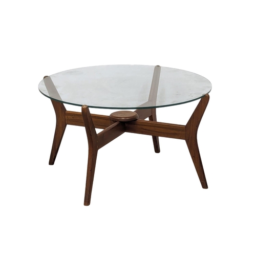 845 - A Mid Century teak glass top coffee table. 75x41cm