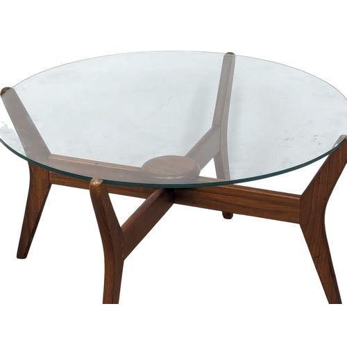 845 - A Mid Century teak glass top coffee table. 75x41cm