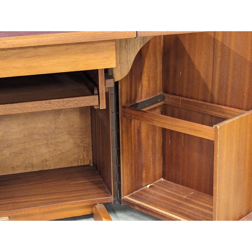 846 - A Mid Century teak home office fold away desk. 84x54x112cm