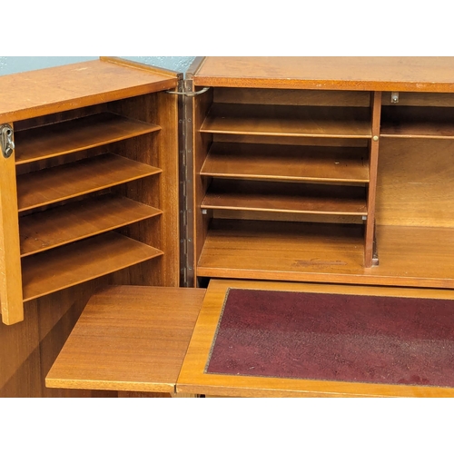 846 - A Mid Century teak home office fold away desk. 84x54x112cm