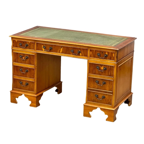 1246 - A George III style Yew wood pedestal desk with leather top.  121x60x76cm