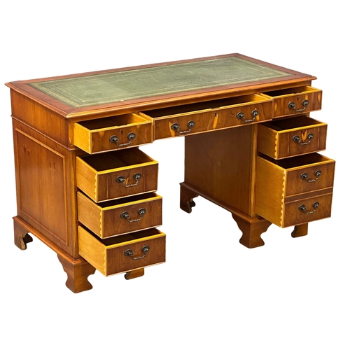 1246 - A George III style Yew wood pedestal desk with leather top.  121x60x76cm