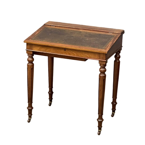 1250 - A Victorian mahogany writing desk with leather top hidden drawer. 70x49x78cm