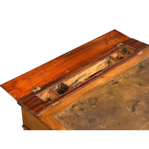 1250 - A Victorian mahogany writing desk with leather top hidden drawer. 70x49x78cm