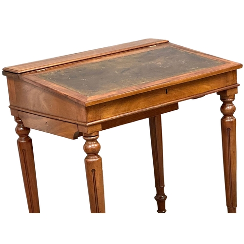 1250 - A Victorian mahogany writing desk with leather top hidden drawer. 70x49x78cm