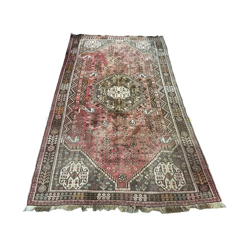 1261 - A large vintage Middle Eastern hand knotted rug. 161x280cm