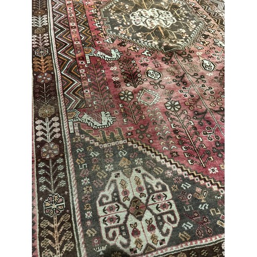 1261 - A large vintage Middle Eastern hand knotted rug. 161x280cm