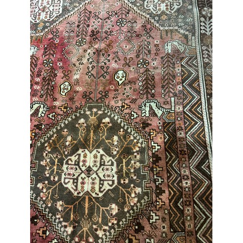 1261 - A large vintage Middle Eastern hand knotted rug. 161x280cm