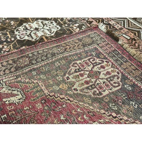 1261 - A large vintage Middle Eastern hand knotted rug. 161x280cm