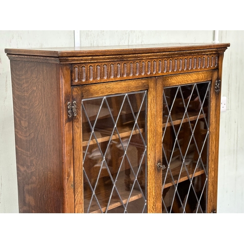 16 - A large oak bookcase. 96x32x139cm