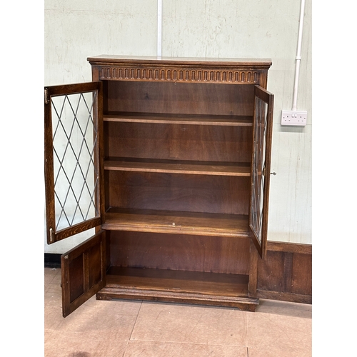 16 - A large oak bookcase. 96x32x139cm