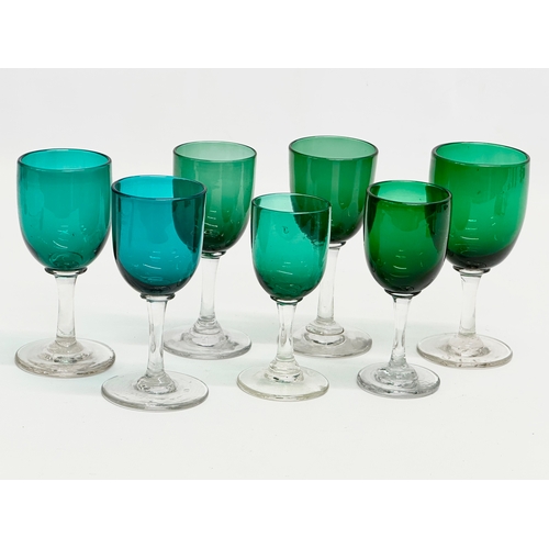 62 - A set of 7 19th Century Victorian Bristol Green and Turquoise port glasses. Circa 1860-1880. 13cm. 1... 