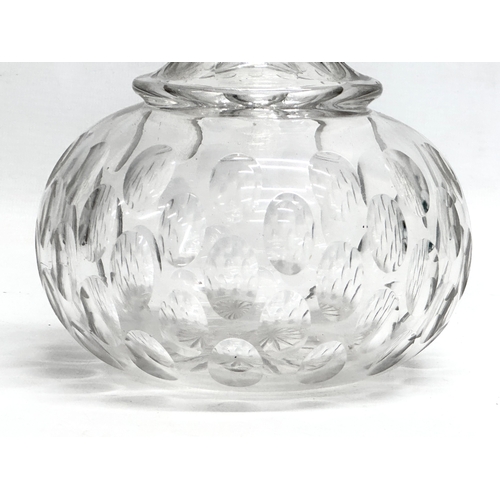 64 - A 19th Century Victorian lens cut decanter. 30.5cm