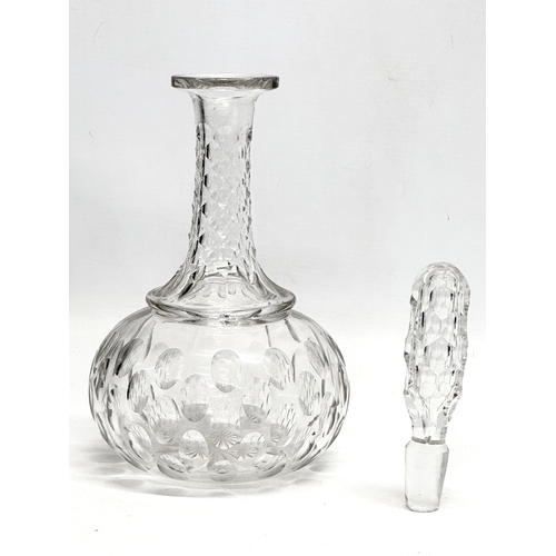 64 - A 19th Century Victorian lens cut decanter. 30.5cm